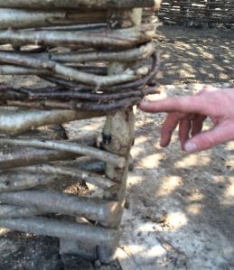 twist the hazel rod around the upright stake so that the stake is locked in place